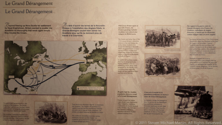 A bilingual exhibit shows a map of Acadian migration routes beside historical text and images.