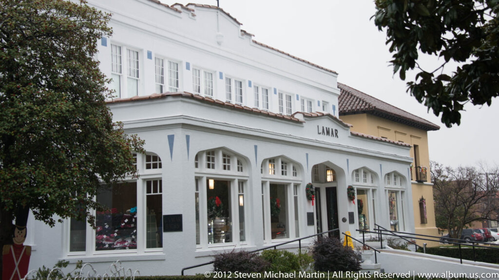 The Lamar Bathhouse facade has arched windows, a central doorway, and an accessibility ramp along the front.