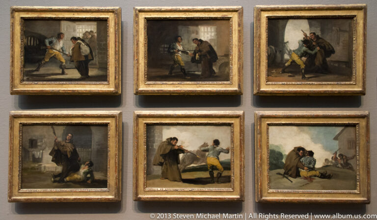 Six small framed paintings show separate scenes with people, arranged in two rows on a gallery wall.