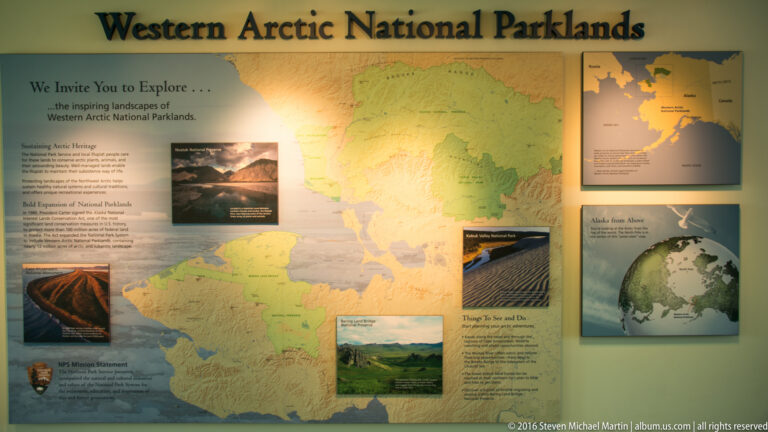 A wall panel titled “Arctic National Parklands” combines a large map, photographs, and text.