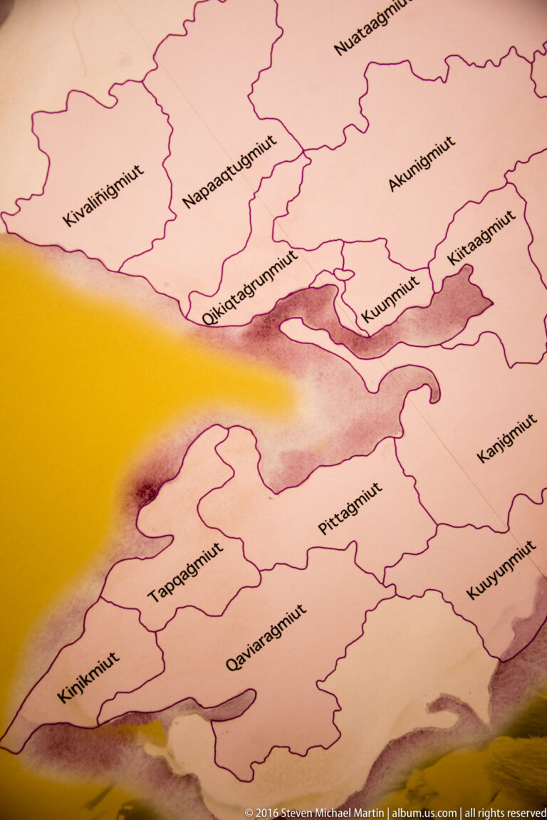A pink regional map displays numerous Iñupiaq place names within irregular boundary lines.