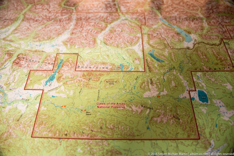 A regional map outlines Gates of the Arctic National Park and Preserve with a dark red boundary.