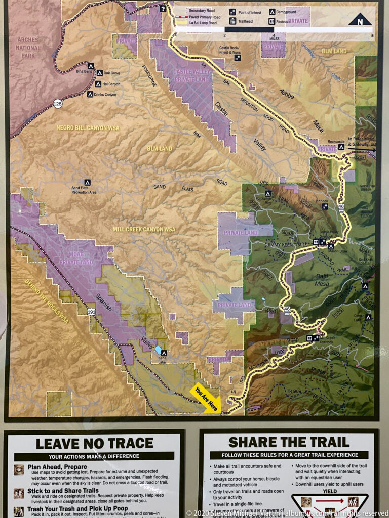A colored trail map sits above two visitor guidance panels titled Leave No Trace and Share the Trail.