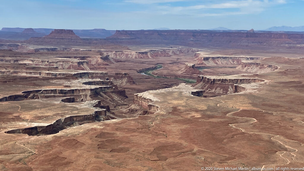 Layered mesas and deep canyons spread across the plateau from a high overlook.