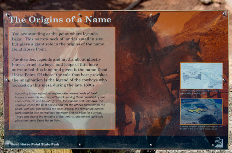 An interpretive panel explains legends behind the name Dead Horse Point beside horse and canyon images.