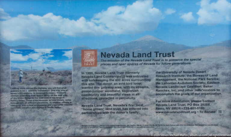 A Nevada Land Trust sign explains landscape conservation beside a small landscape photograph.