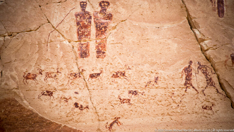 Two tall patterned figures appear above smaller animal-like forms, with an outline figure at right.