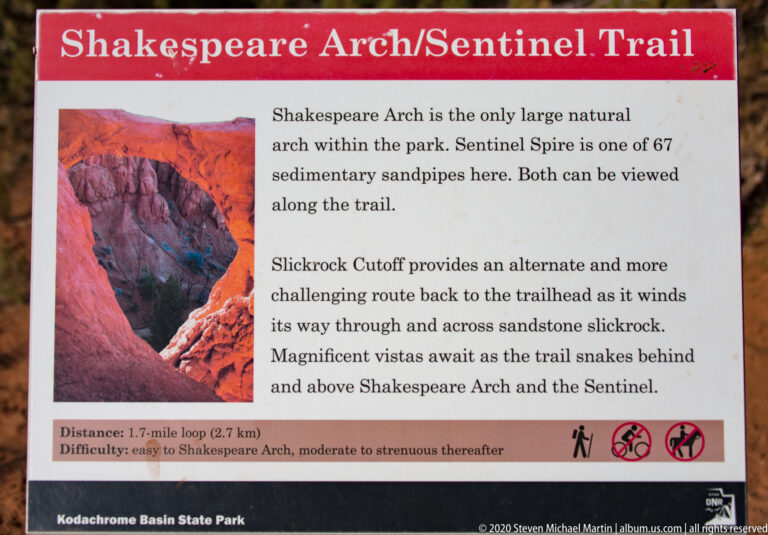 A trail sign names Shakespeare Arch and Sentinel Spire, with route details and an arch photograph.