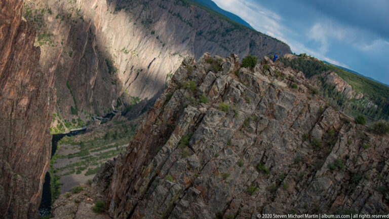 A jagged promontory divides the view across steep cliffs to the river far below.