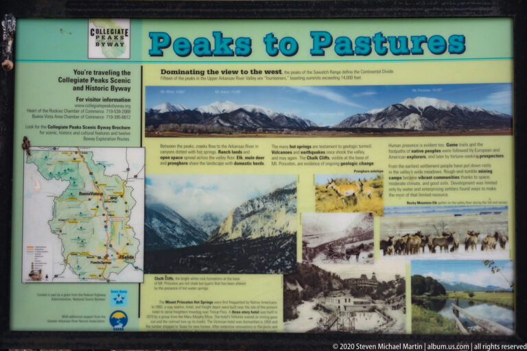 A green “Peaks to Pastures” interpretive panel displays a regional map, mountain photographs, historic images, and explanatory text.