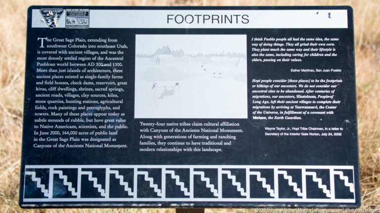 A “Footprints” sign displays text, a map-like graphic, and quotations above a geometric border.
