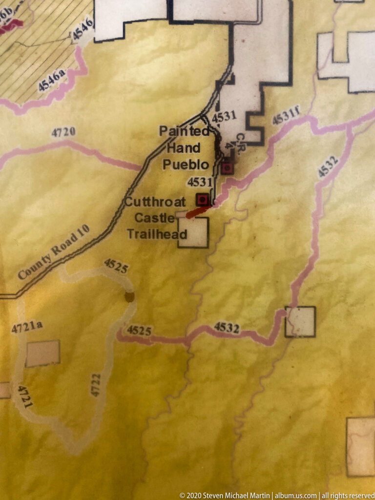 A close map view labels Painted Hand Pueblo and Cutthroat Castle Trailhead among roads and colored boundaries.