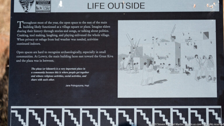 A sign titled “Life Outside” pairs text with a drawing of people in an outdoor pueblo setting.