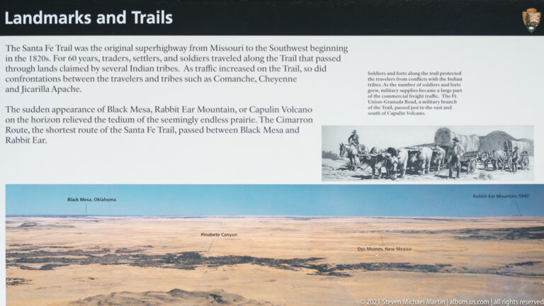 A wide “Landmarks and Trails” panel pairs a historic wagon image and text with a labeled panorama of the plains.