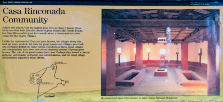 An interpretive panel shows a timber-roofed interior, a small site plan, and explanatory text about a Chacoan structure.