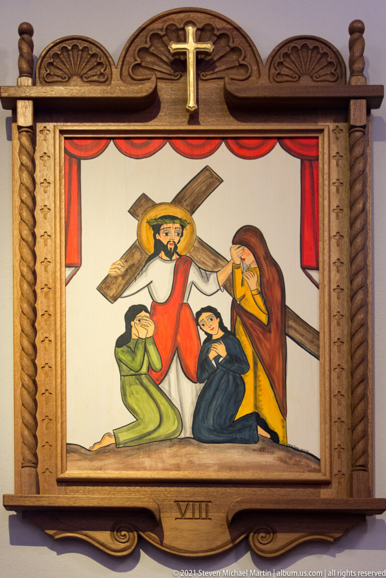 Framed painting of Christ carrying a cross above two kneeling women, marked with the Roman numeral VIII.