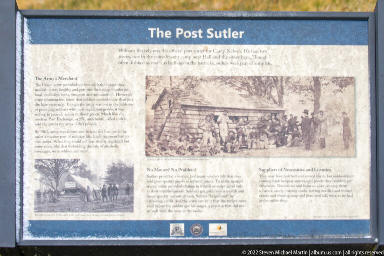 A Post Sutler history panel shows archival photographs of a wooden building and a group of people.