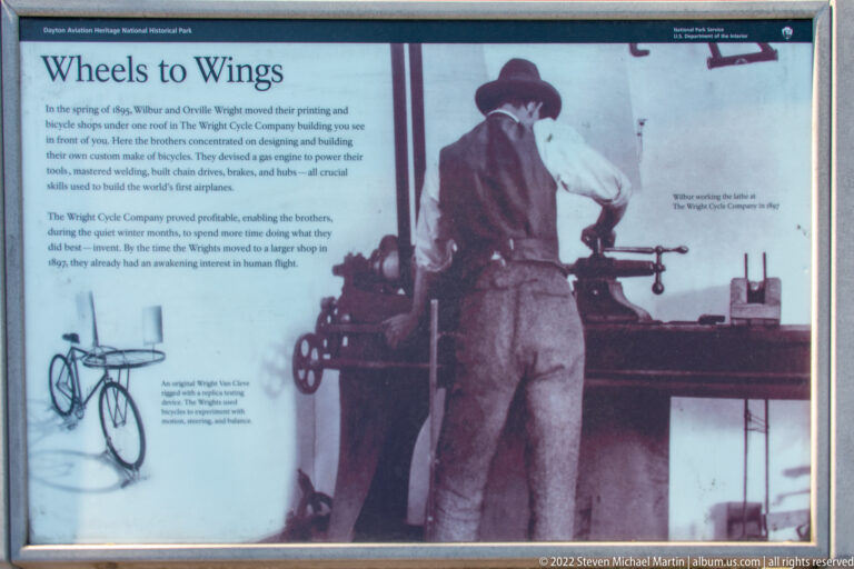 A Wright bicycle shop panel shows a worker at machinery beside text and a small bicycle drawing.