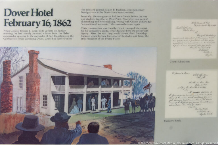 A museum panel combines a painting of a crowd outside a large building with reproduced handwritten letters.