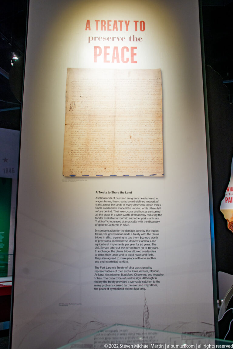 A handwritten treaty document is displayed beneath the heading “A Treaty to Promote Peace.”