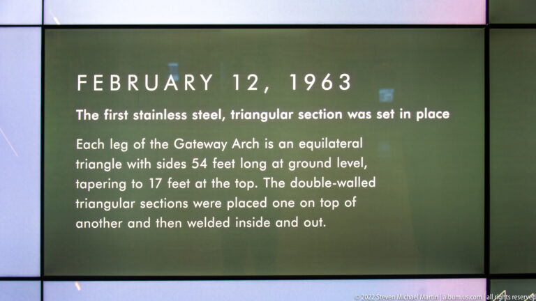 A museum panel dated February 12, 1963, explains the first stainless-steel triangular section of the Gateway Arch.