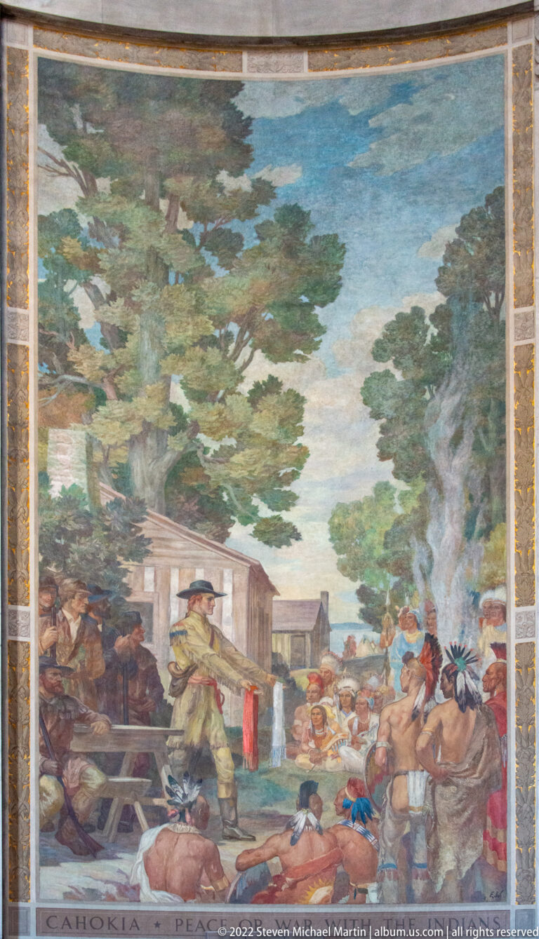 Mural labeled “Cahokia: Peace” shows a central speaker addressing a gathering beneath trees.