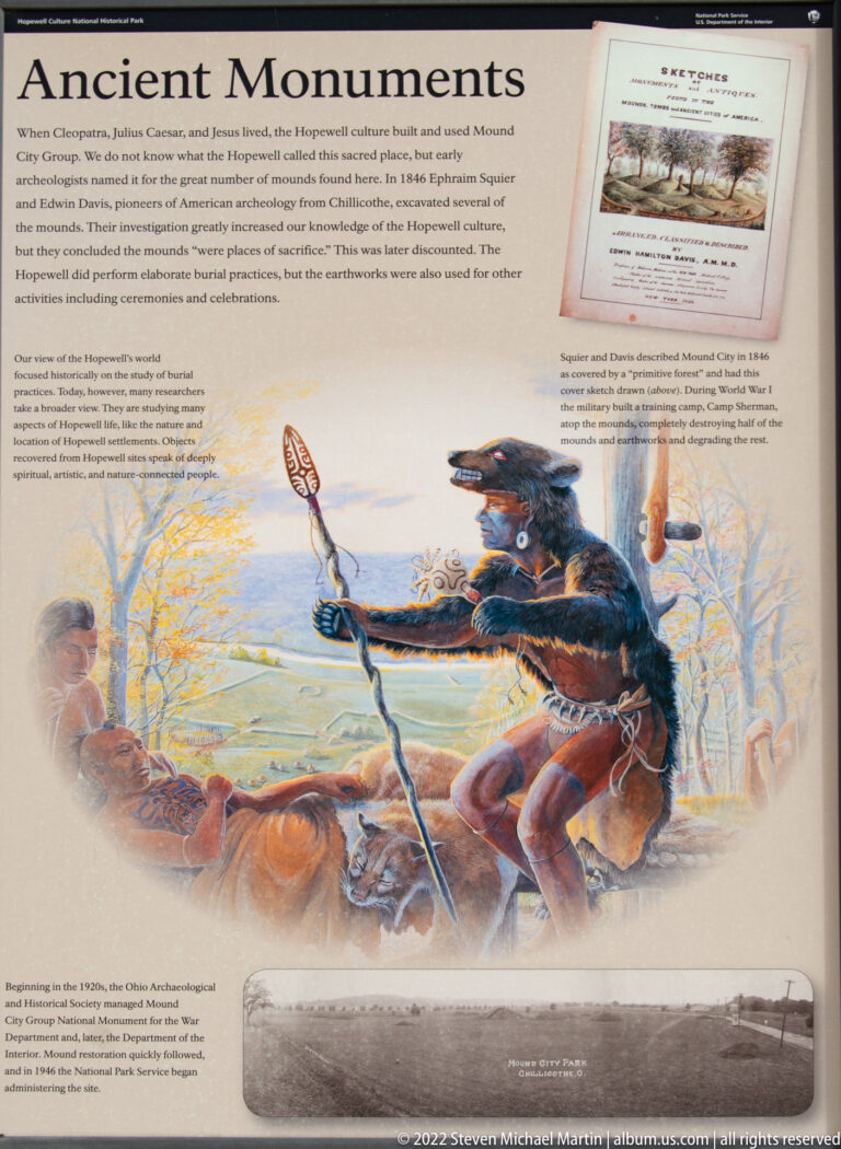 A Monuments panel pairs a reconstruction of people near an earthwork with an archival photograph.