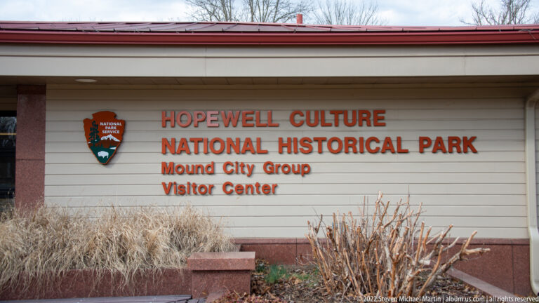 Orange lettering names the Hopewell Culture National Historical Park and Mound City Group Visitor Center.
