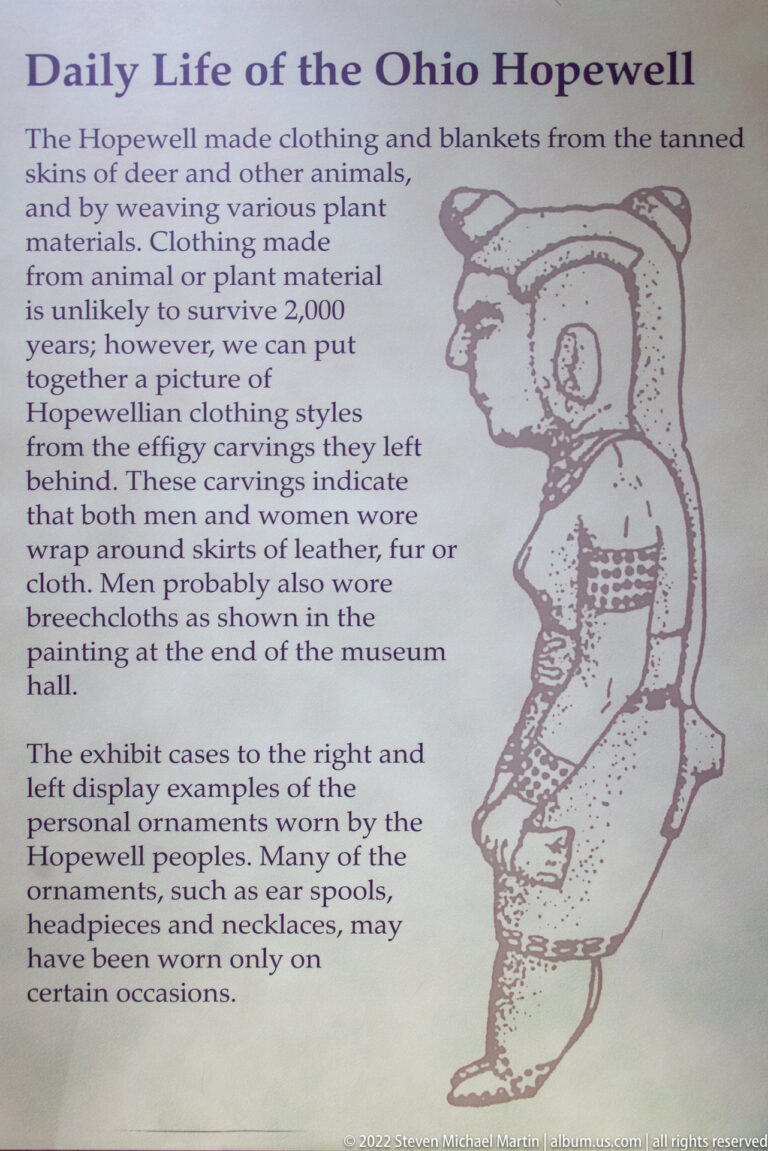 Interpretive panel about Ohio Hopewell clothing, with text at left and a seated figure drawing at right.