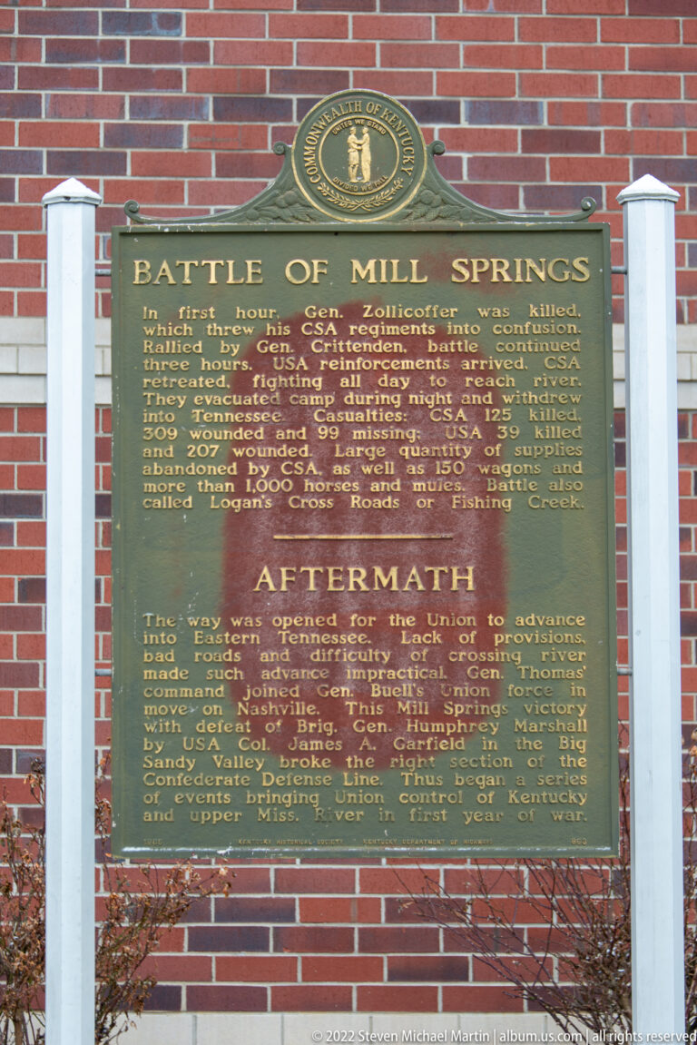A green plaque titled Battle of Mill Springs and Aftermath is mounted on brick.