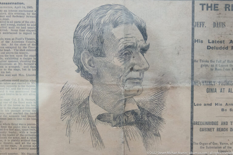 Engraved caricature of Jefferson Davis over a newspaper page with a bold headline and columns.