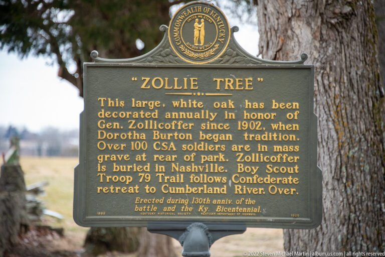 A “Zollie Tree” marker stands before a large oak and describes a memorial tradition honoring General Zollicoffer.