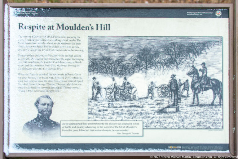 A Moulden’s Hill history panel pairs a uniformed officer’s portrait with a drawing of soldiers and artillery in a snowy field.