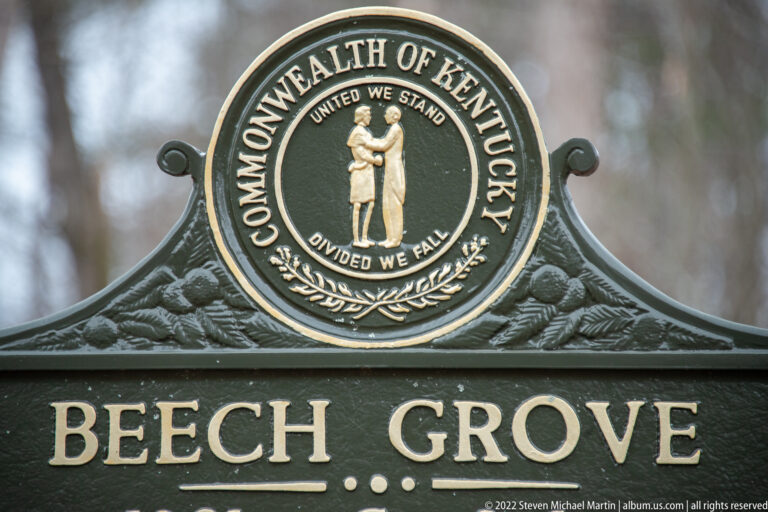 A close view of a Beech Grove sign shows the Kentucky seal above its gold-lettered title.