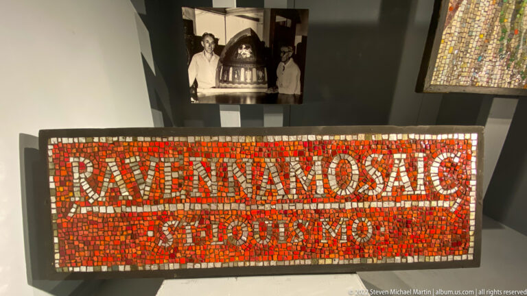 A mosaic sign reading “Ravenna Mosaic St. Louis, Mo.” sits beneath a small archival photograph.