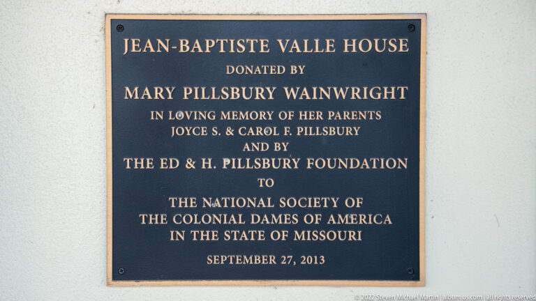 A plaque names the Jean-Baptiste Valle House and records its 2013 donation and dedication.
