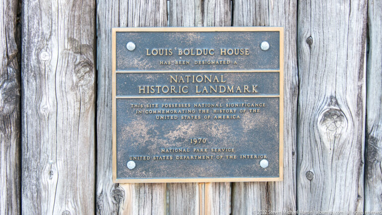 A bronze plaque identifies the Louis Bolduc House as a National Historic Landmark designated in 1970.