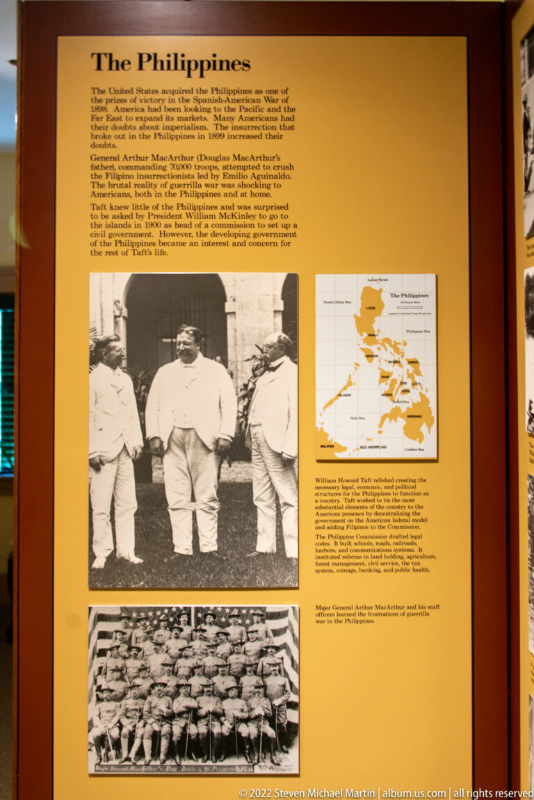 A yellow Philippines panel combines text, a map, and two archival photographs, including three men outdoors.