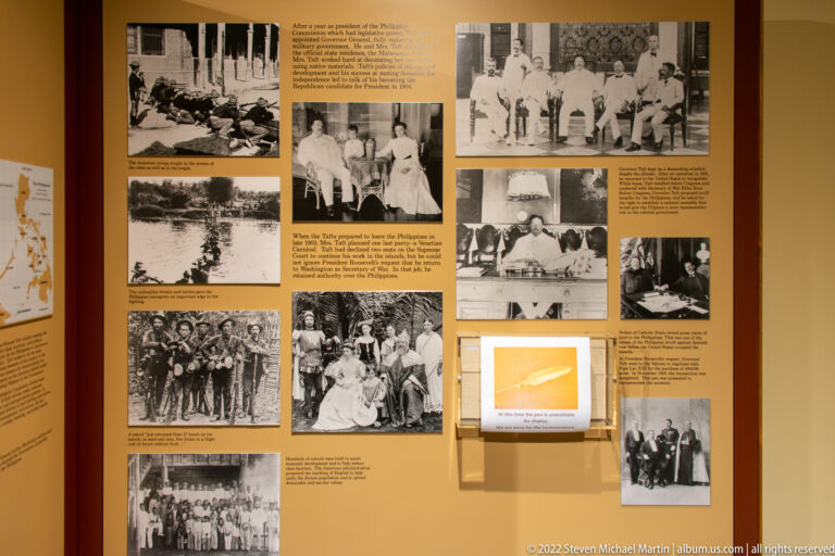 A yellow exhibit wall displays archival photographs and text blocks about Taft’s Philippine-era activities.