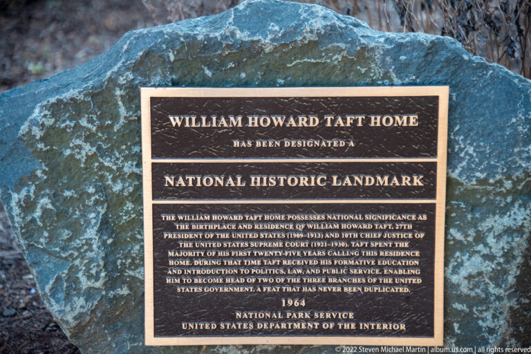 A bronze plaque on a boulder designates the William Howard Taft Home as a National Historic Landmark.