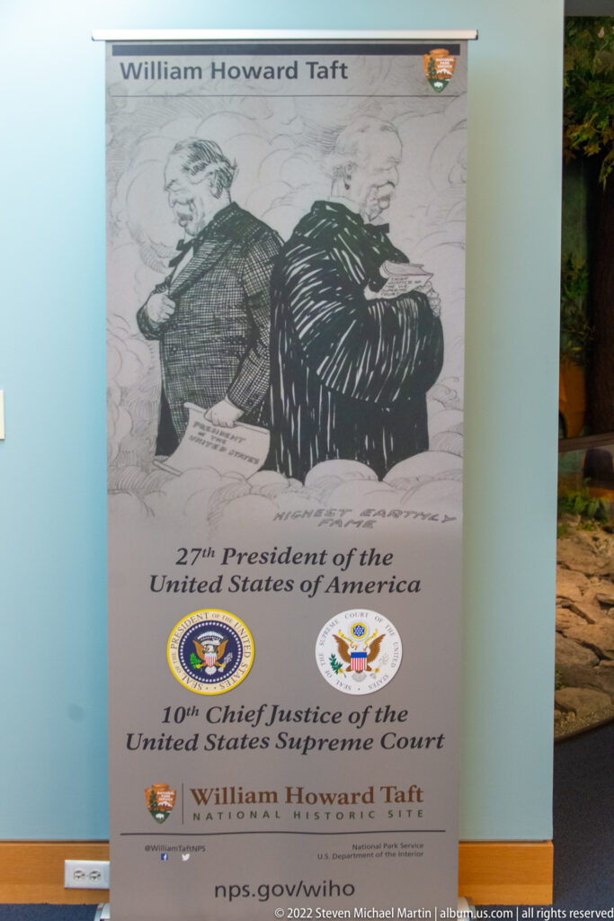 A William Howard Taft poster names him as the 27th president and 10th chief justice beneath a political cartoon.