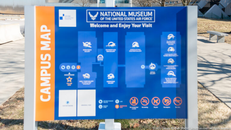 A blue visitor sign maps galleries at the National Museum of the United States Air Force.