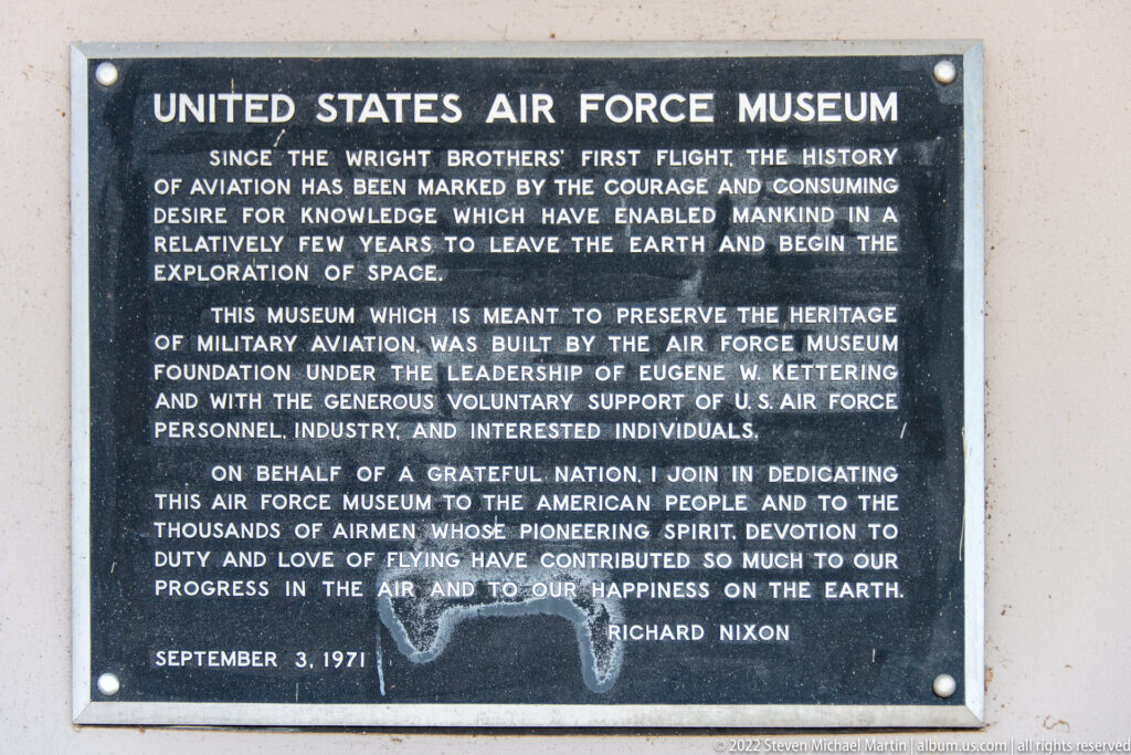 A plaque describes the Air Force Museum’s mission and records its September 3, 1971 dedication by Richard Nixon.