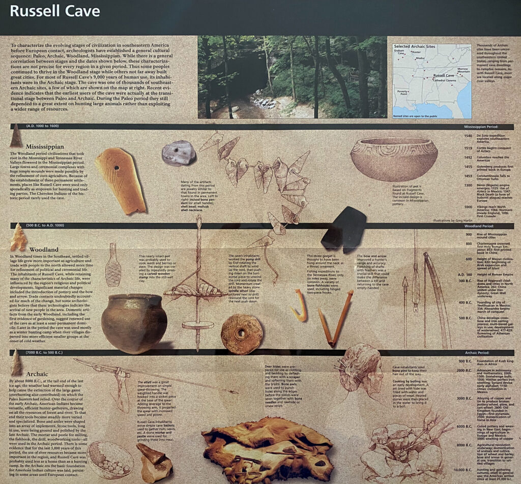 A Russell Cave display arranges artifact images and explanatory text across cultural-period timeline bands.