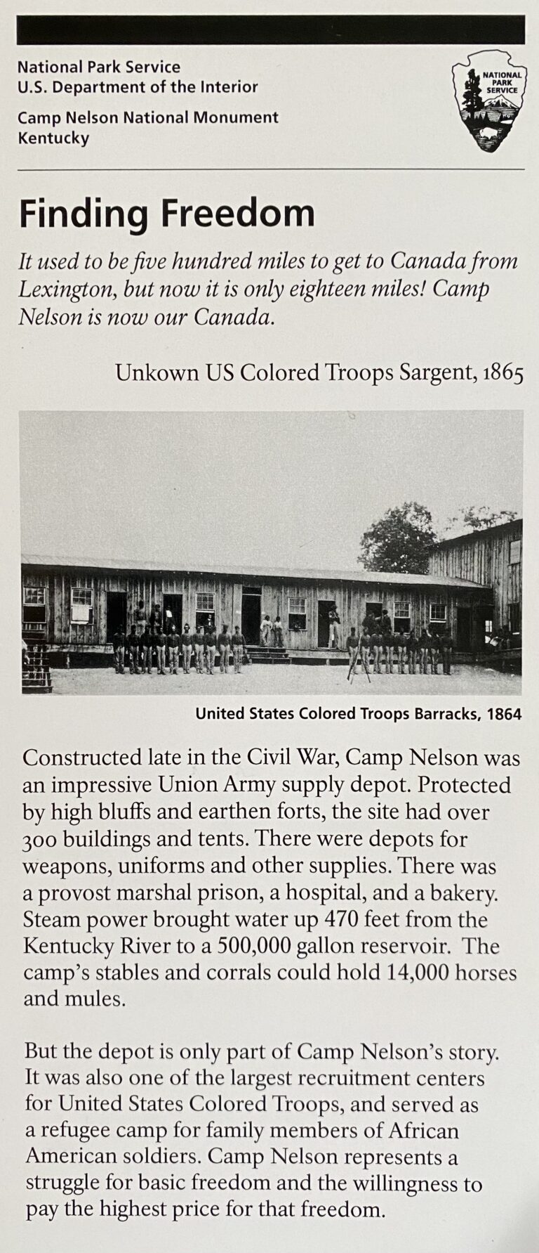 A Freedom panel pairs a portrait labeled as an unknown U.S. Colored Troops sergeant with a barracks photograph.