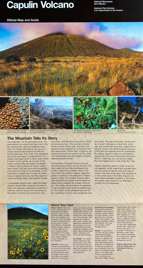 An open Capulin Volcano National Park Service brochure shows a panoramic banner, smaller photographs, maps, and information columns.