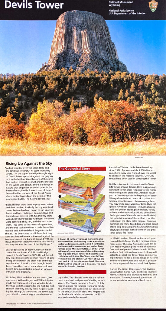 A Devils Tower interpretive panel pairs a landscape photograph with a colored geological diagram and text.