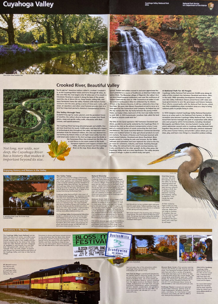 An open Cuyahoga Valley National Park brochure displays river and waterfall photographs, text columns, and a heron illustration.
