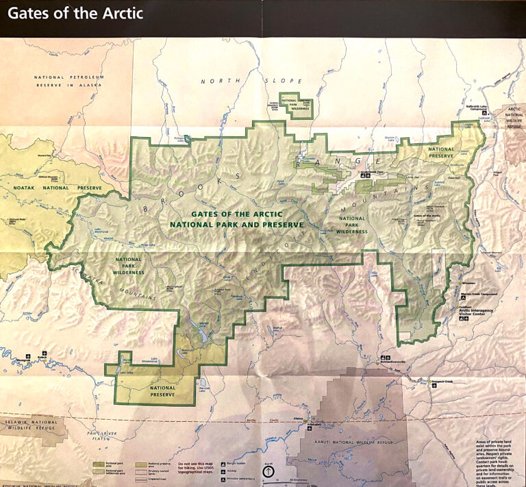A relief map of northern Alaska marks the green boundary of Gates of the Arctic National Park and Preserve among surrounding protected areas.