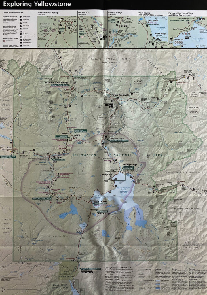 A folded Yellowstone map shows shaded terrain, labeled roads and sites, inset maps across the top, and a legend below.